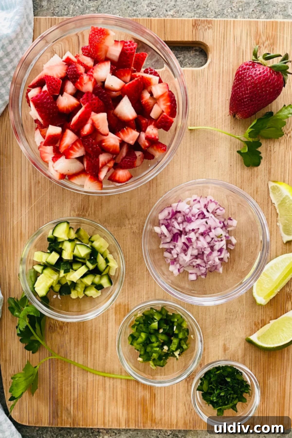 Pork Tenderloin Strawberry Jalapeno Sensation 4 Chopped ingredients for strawberry jalapeno salsa including cucumber, red onion, jalapeno, parsley, and lime