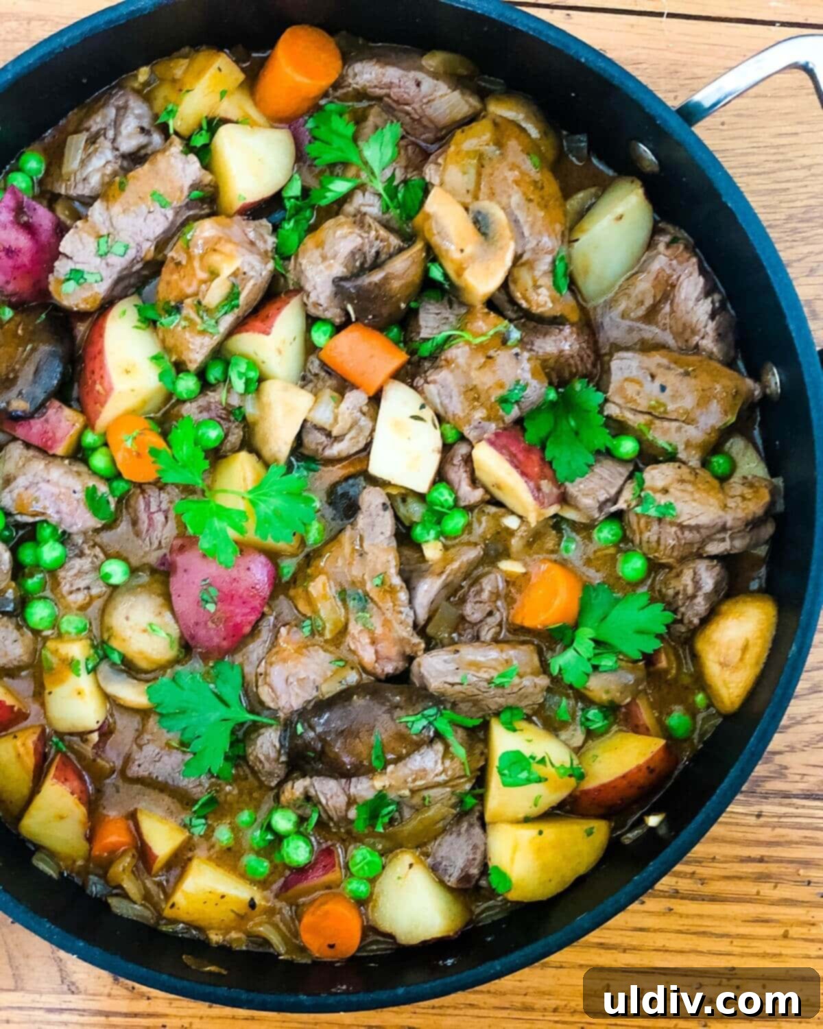 Beef Tenderloin, Mushroom & Potato Stew 5 Beef Tenderloin Stew with New Potatoes and Mushrooms cooking in a large sauté pan, illustrating the one-pot cooking method.