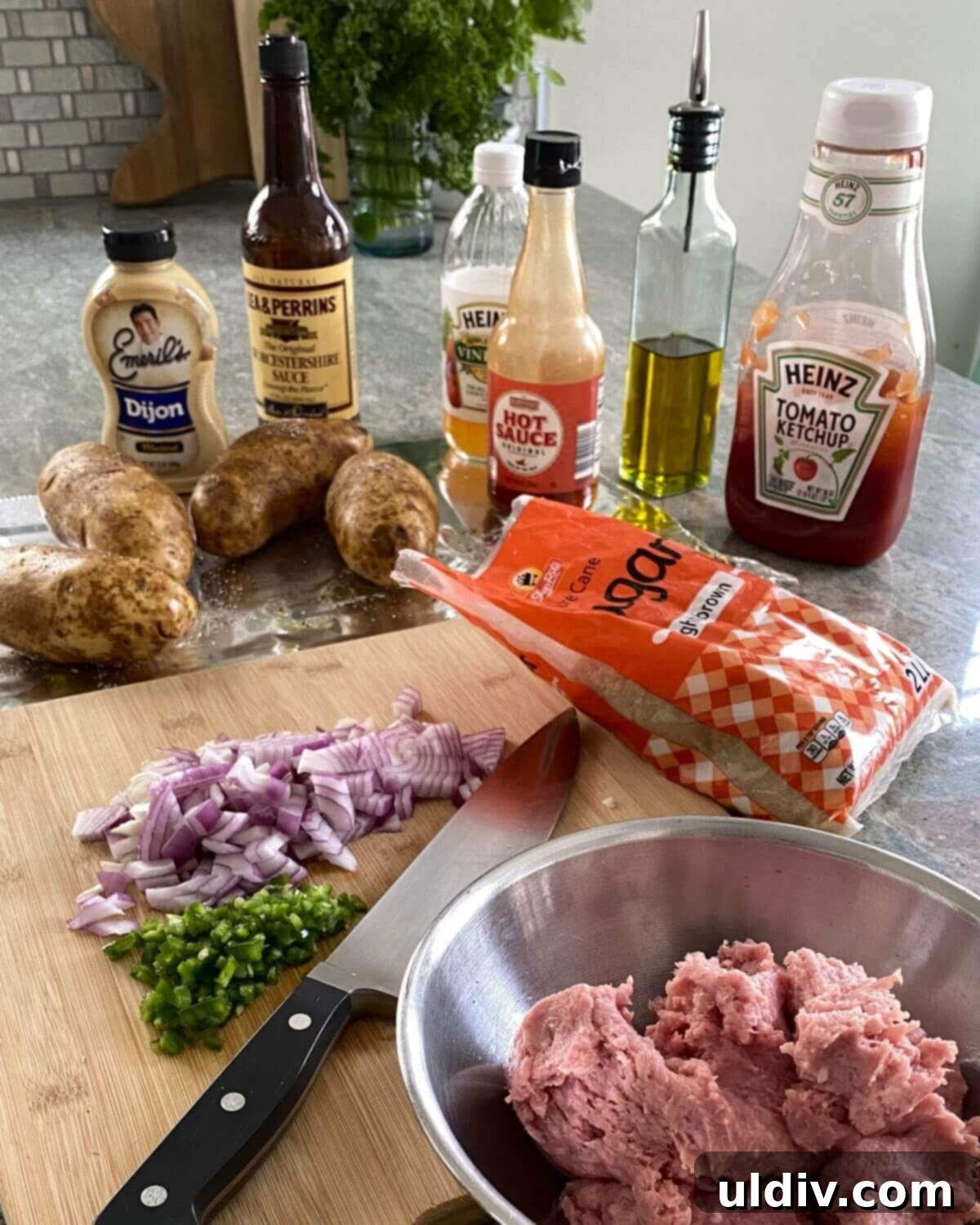 Turkey Sloppy Joe Potato Bake 3 A vibrant display of fresh ingredients for Turkey Sloppy Joe Baked Potatoes, including russet potatoes, ground turkey, ketchup, diced onion, and jalapeno pepper.
