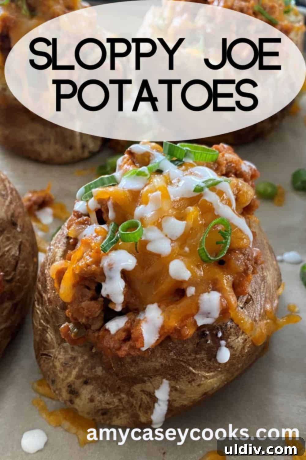 Turkey Sloppy Joe Potato Bake 10 A top-down view of a large baked potato generously stuffed with savory sloppy joe mixture, topped with melted cheese, ready for serving.