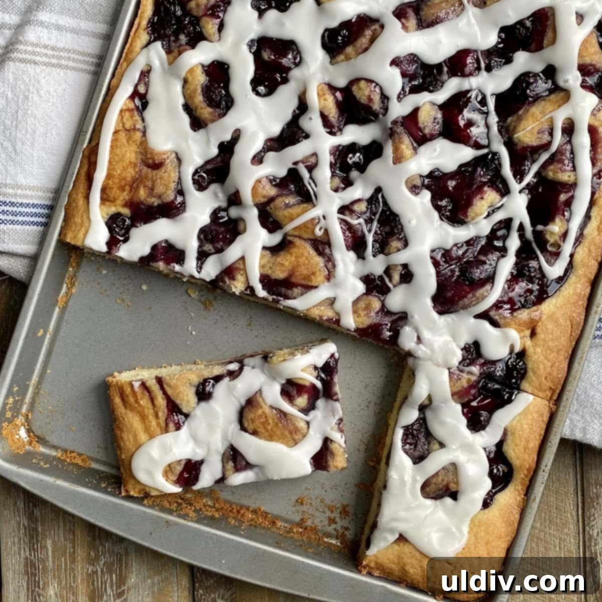 One-Pan Scone Cake 7 A delicious scone breakfast cake with blueberries, ready to be served.