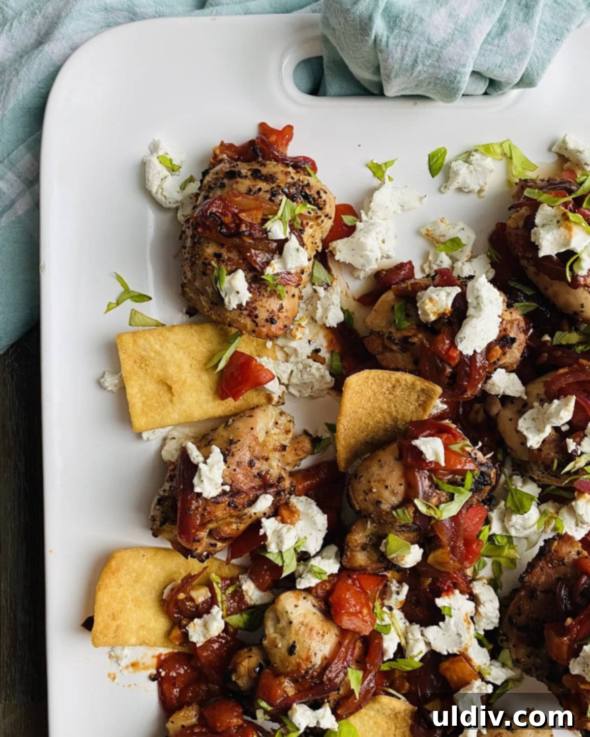 Tuscan Grilled Chicken with Goat Cheese and Sautéed Tomato Basil 8 platter with grilled chicken thighs and bruschetta