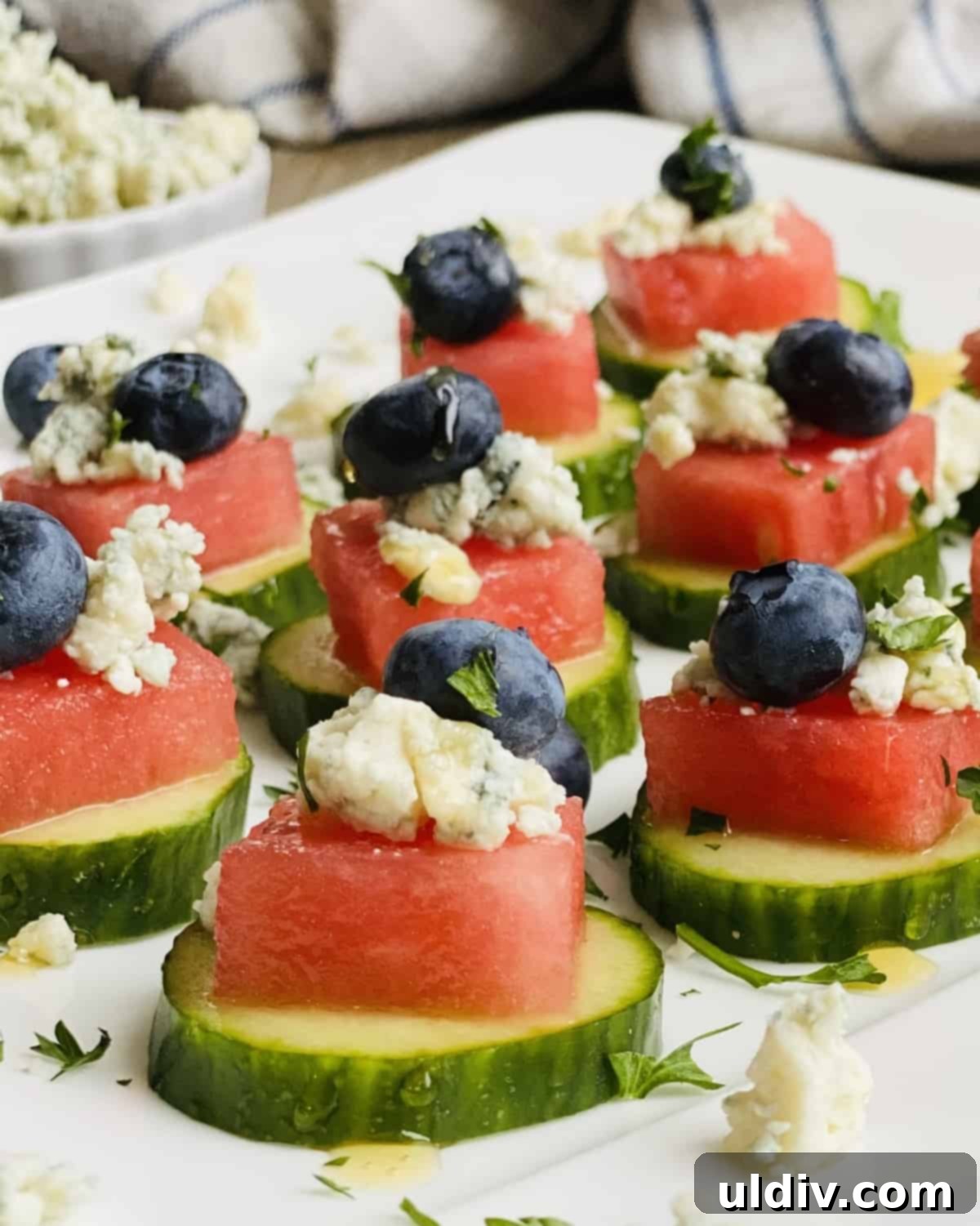 Watermelon Cucumber Blue Cheese Poppers 2 cucumber slices with watermelon blue cheese and blueberries