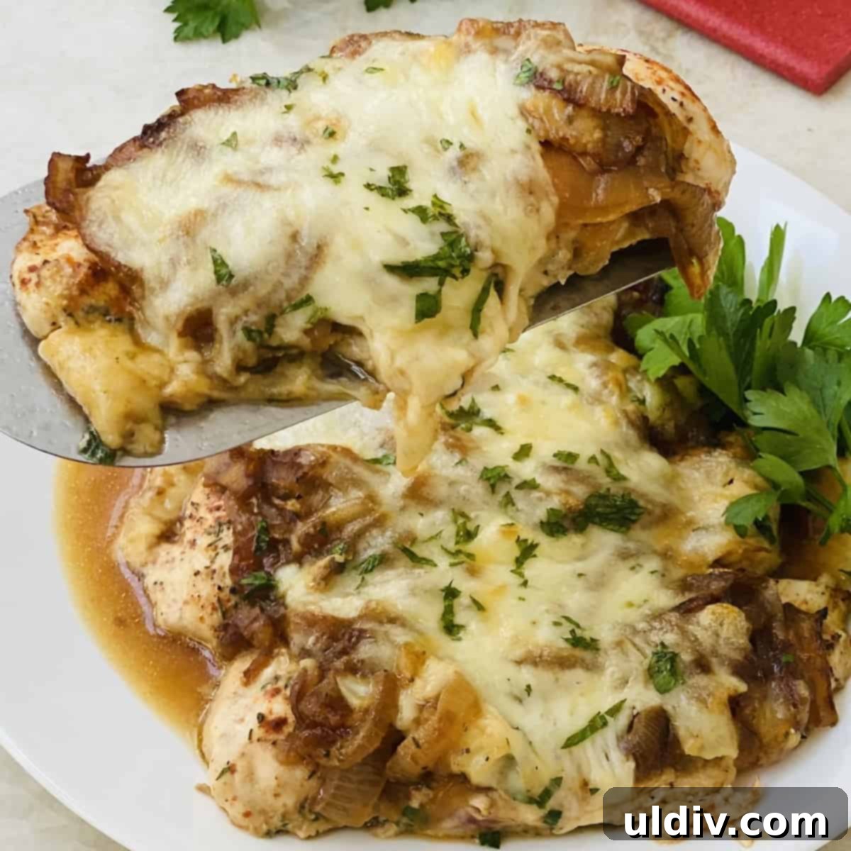 Classic French Onion Chicken Bake 10 Chicken with caramelized onions and melted mozzarella, ready to serve.