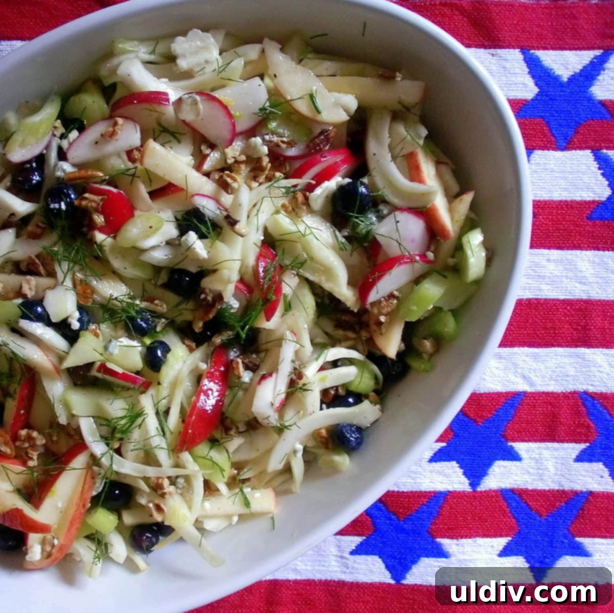 Crisp Apple, Fennel, and Radish Slaw with Blue Cheese and Pecans 7 A close-up of the prepared apple fennel slaw with pecans and blue cheese in a serving bowl, ready to be enjoyed.