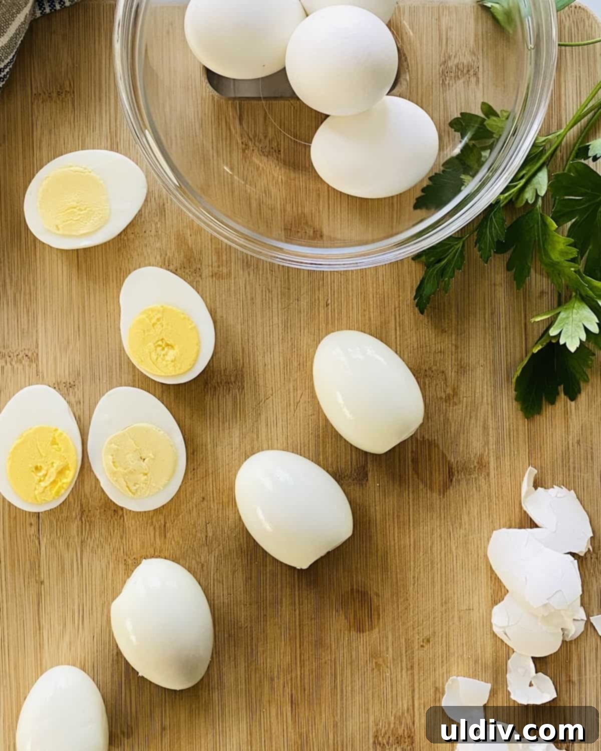 Jalapeno Fire Deviled Eggs 4 Freshly cooked hard-boiled eggs with some peeled shells, ready for preparation into spicy deviled eggs.