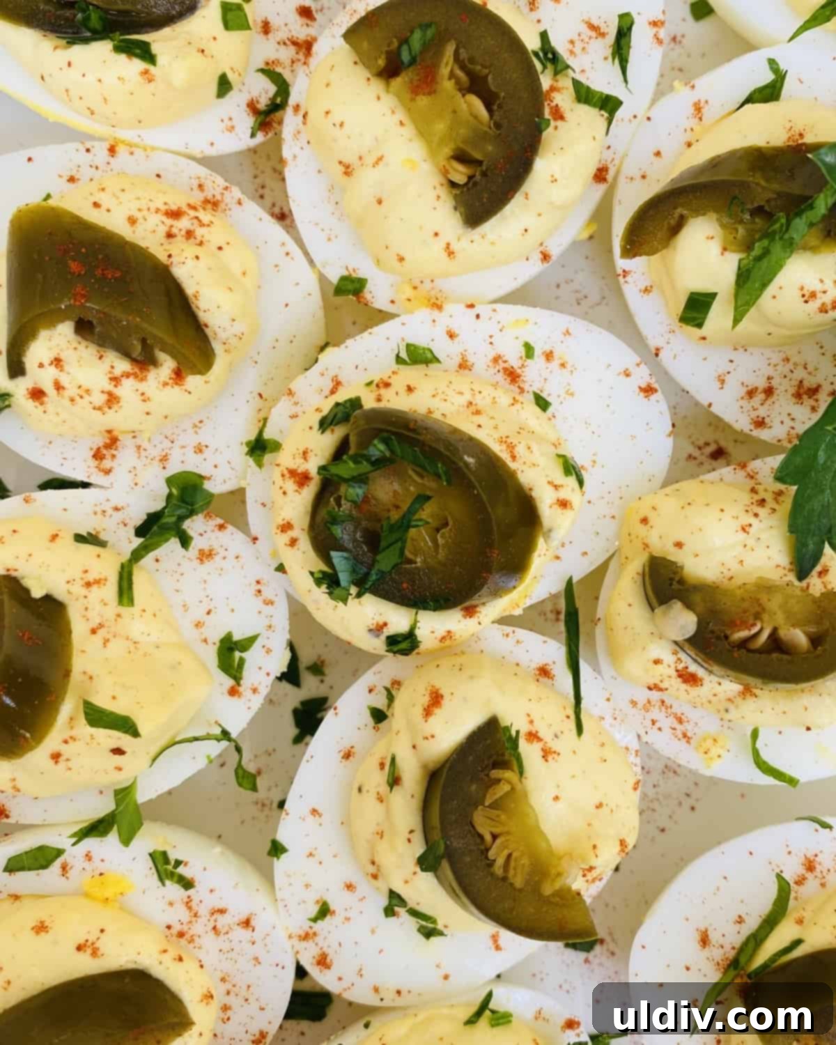 Jalapeno Kick Deviled Eggs 7 A tray of ten spicy deviled eggs, each perfectly filled and garnished