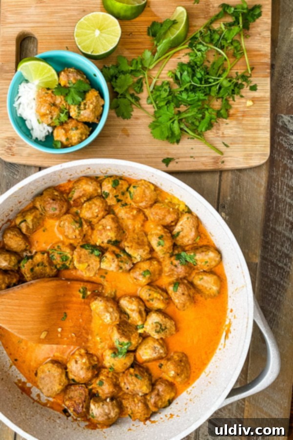 Thai Red Curry Turkey Meatball Delight 3 Pan of Thai meatball curry topped with fresh cilantro, ready to be served.