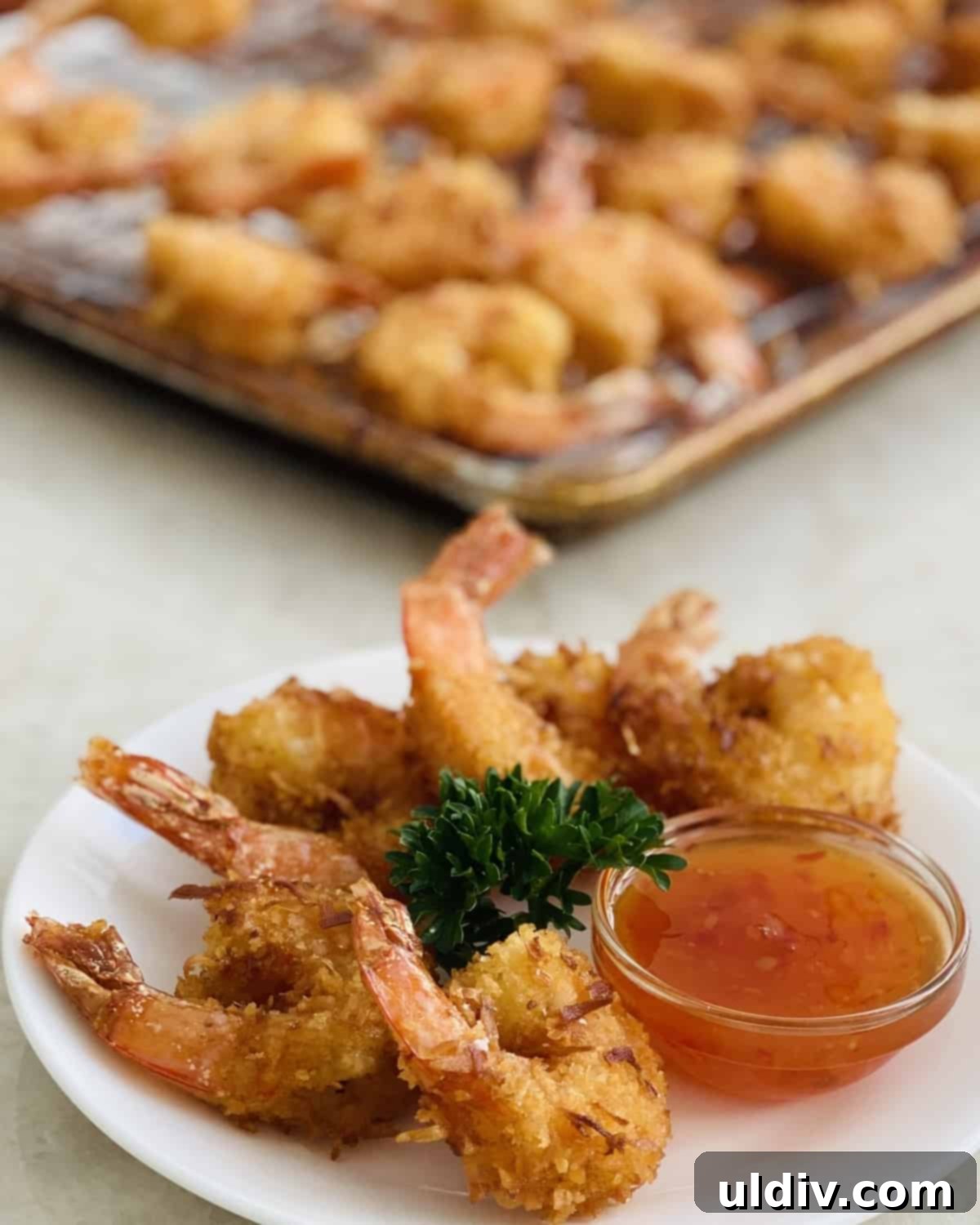 Tropical Coconut Crunch Shrimp 8 Platter of golden crispy coconut shrimp ready to be served