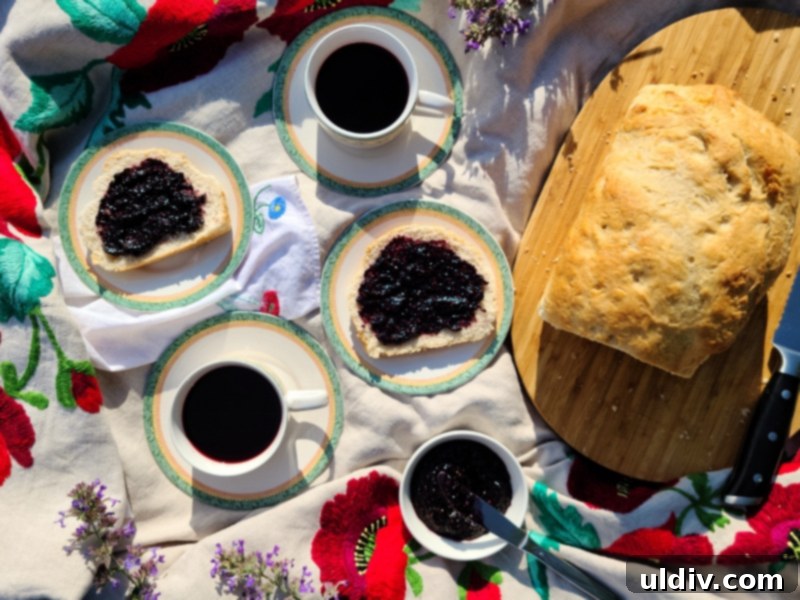 Another artistic presentation of homemade bread with mulberry jam and hibiscus tea at sunset
