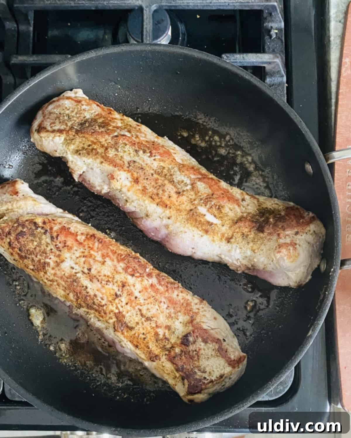 Maple Glazed Tenderloin with Caramelized Apples 4 Searing 2 pork tenderloins in a cast iron skillet.