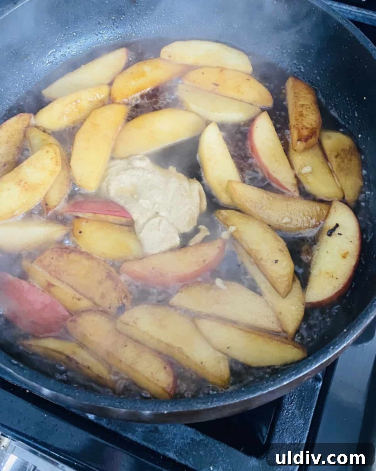 Maple Glazed Pork Tenderloin with Caramelized Apples 6 Sauteing apples in butter with maple syrup and Dijon mustard.