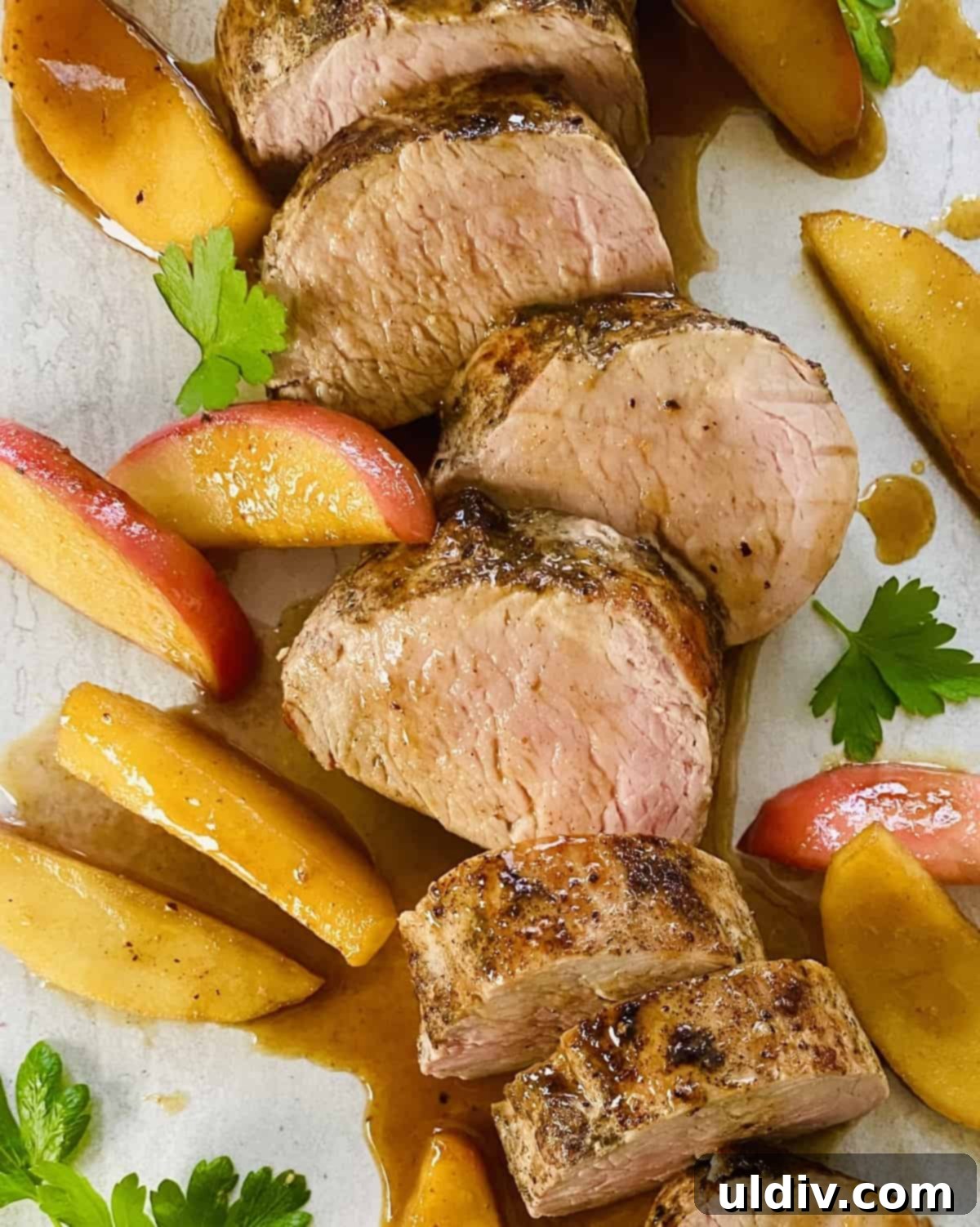 Maple Glazed Pork Tenderloin with Caramelized Apples 7 Slices of maple glazed pork tenderloin with sauteed apples.