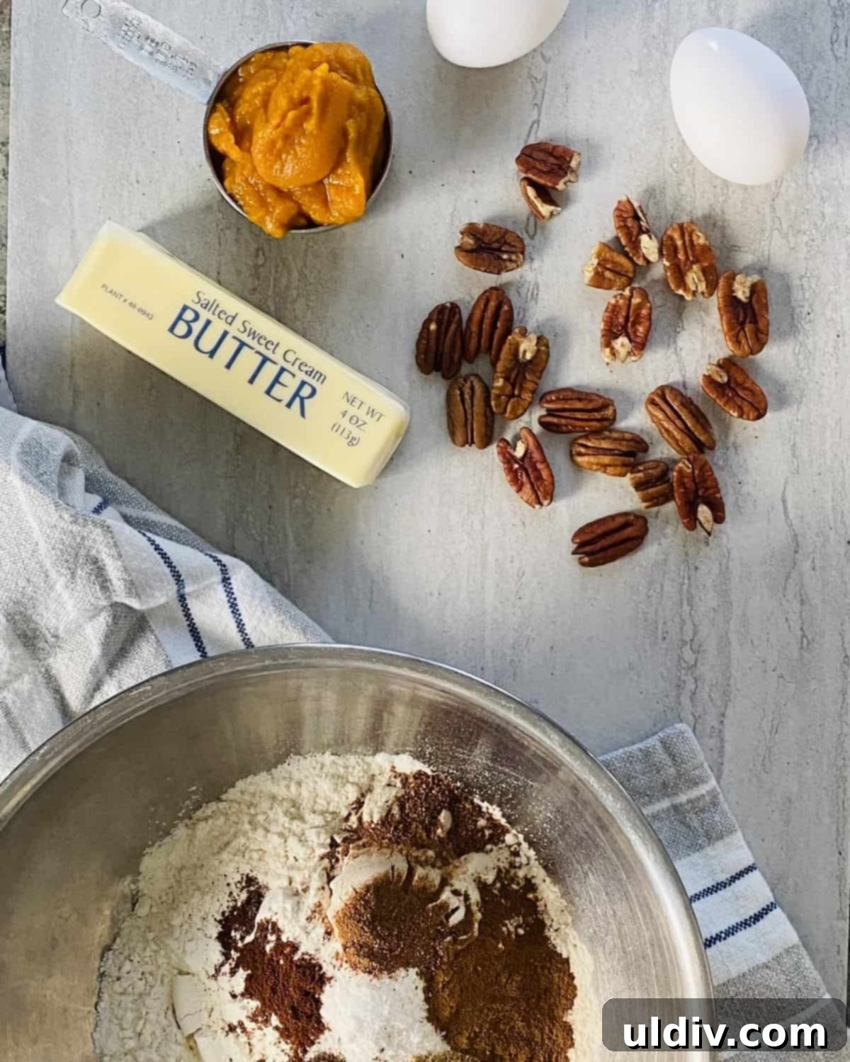 Pillowy Pumpkin Spice Cookies with Dreamy Buttercream 3 pecans, pumpkin puree, butter, flour, cinnamon, essential ingredients for pumpkin spice cookies