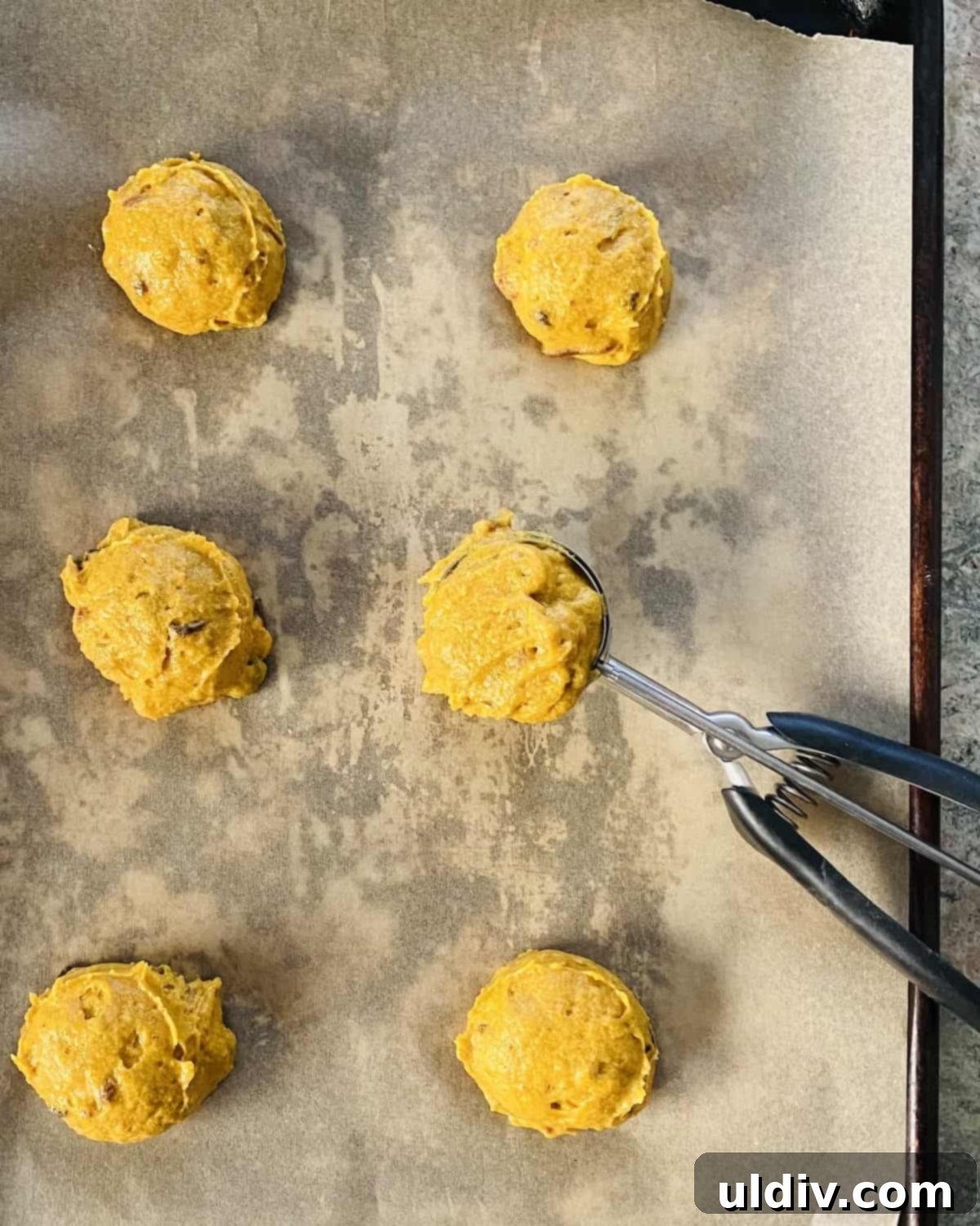 Velvet Pumpkin Spice Cookies, Buttercream Crowned 5 Scooping pumpkin spice cookie dough onto a parchment-lined baking sheet