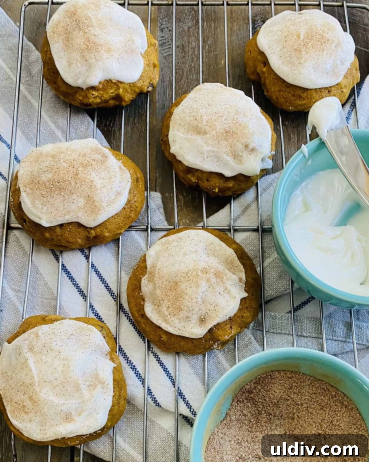 Pillowy Pumpkin Spice Cookies with Dreamy Buttercream 6 frosted pumpkin spice cookies on a cooling rack