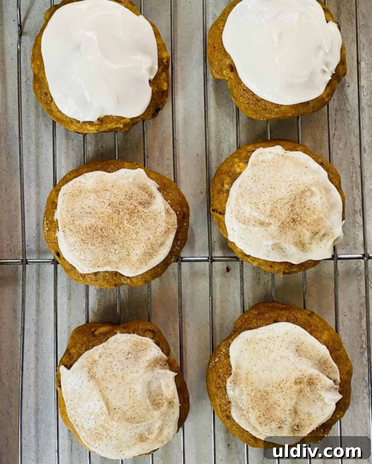 Pillowy Pumpkin Spice Cookies with Dreamy Buttercream 7 pumpkin spice cookies with frosting and cinnamon sugar, close up