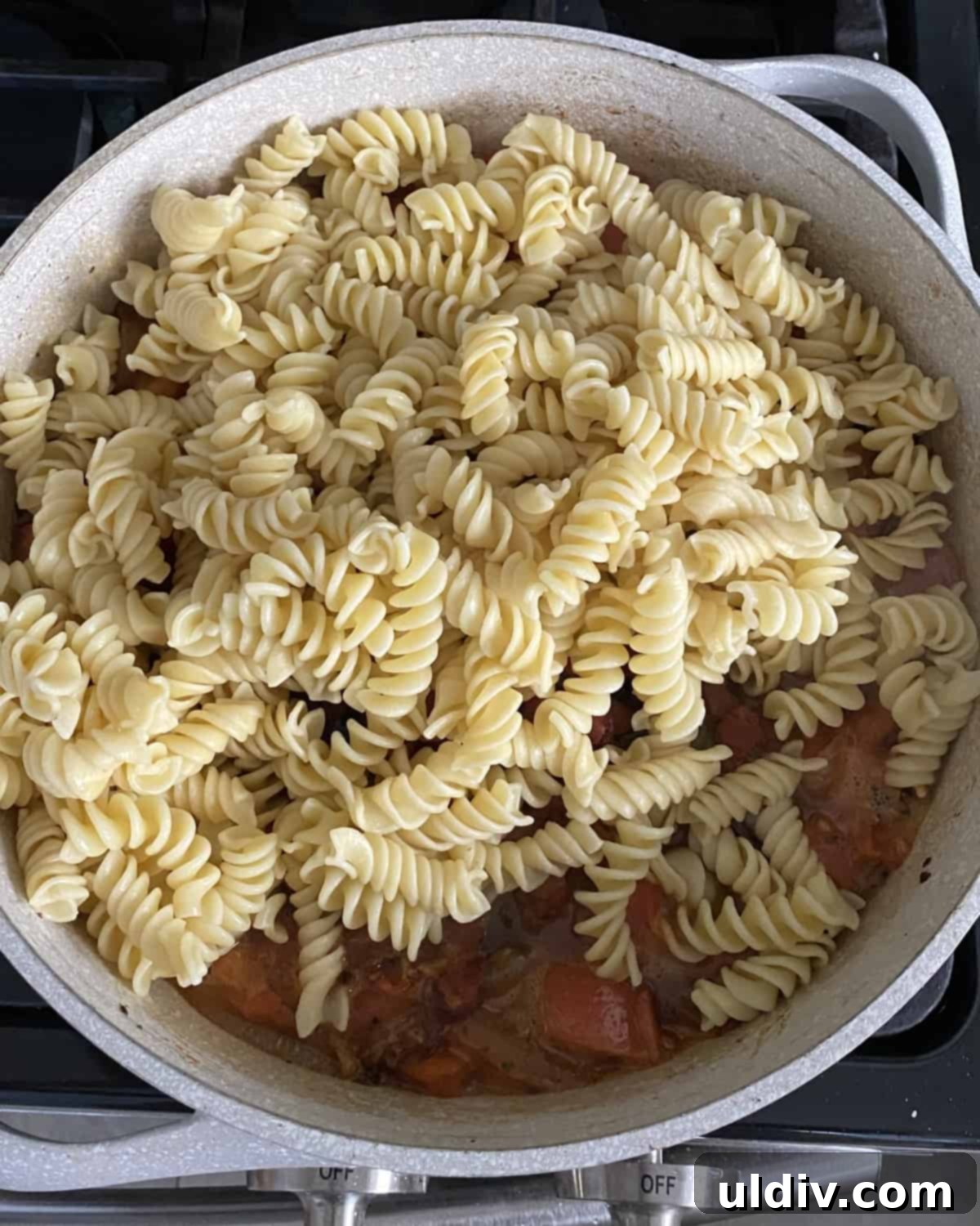 Smoky Bacon, Tomato and Pea Pasta 5 adding cooked pasta to sauce