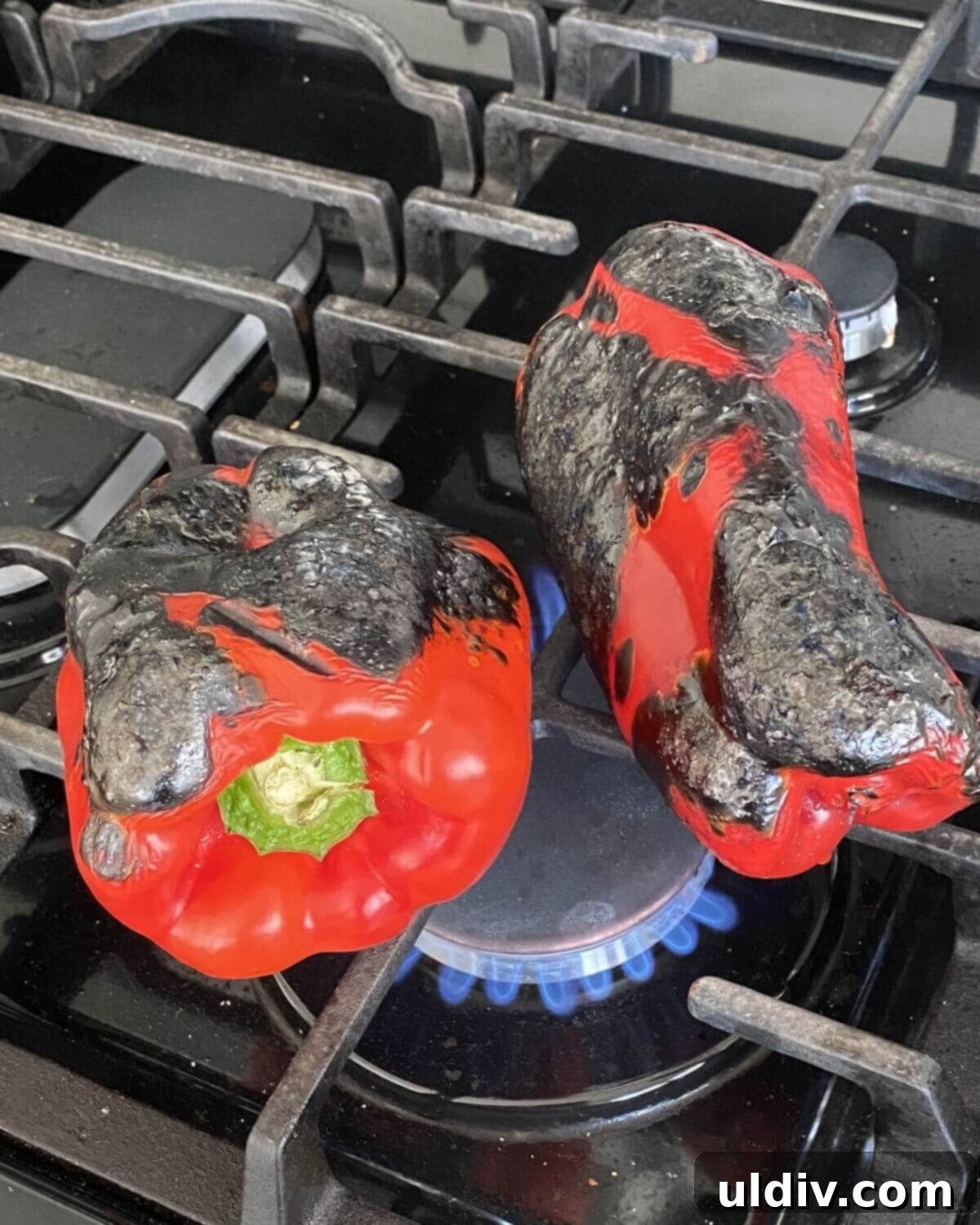Vibrant Caprese Chicken Sandwich 4 Roasting red peppers over a gas flame.