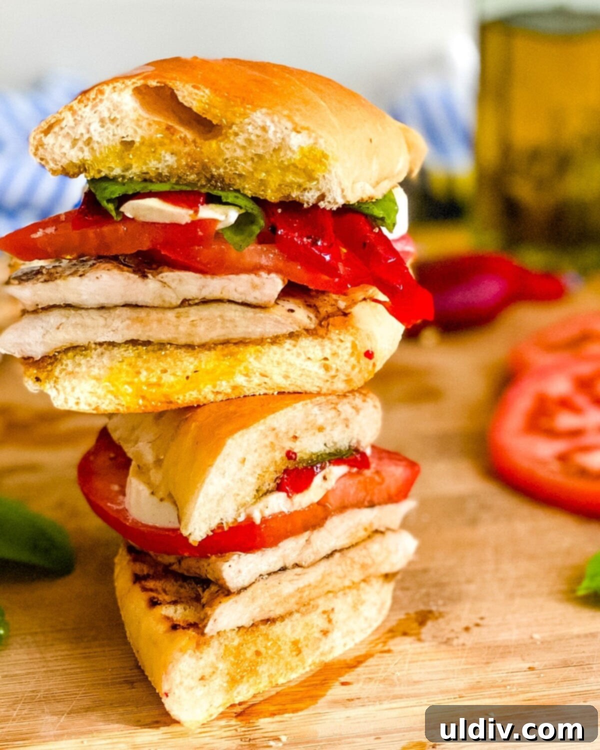 Vibrant Caprese Chicken Sandwich 7 A chicken caprese sandwich cut in half.