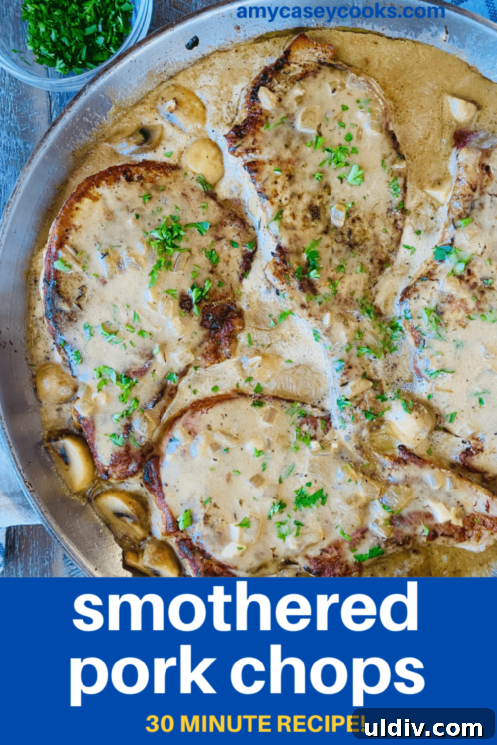 Braised Pork Chops with Savory Mushroom Sauce 13 A pan of pork chops with a creamy gravy.