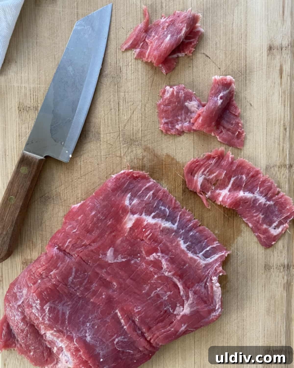 Tender Beef and Crisp Snap Pea Stir Fry 4 Thinly sliced flank steak prepared for a beef stir fry recipe.