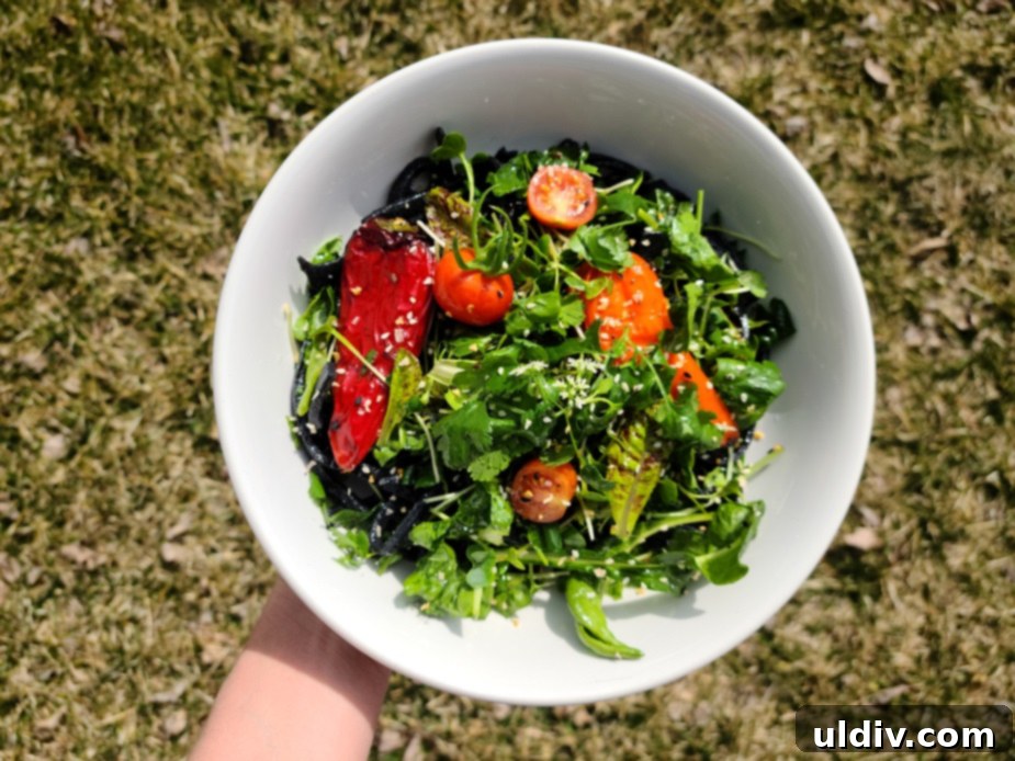 Detox pasta salad with activated charcoal pasta, Freckles lettuce, Swiss chard, and microgreens.