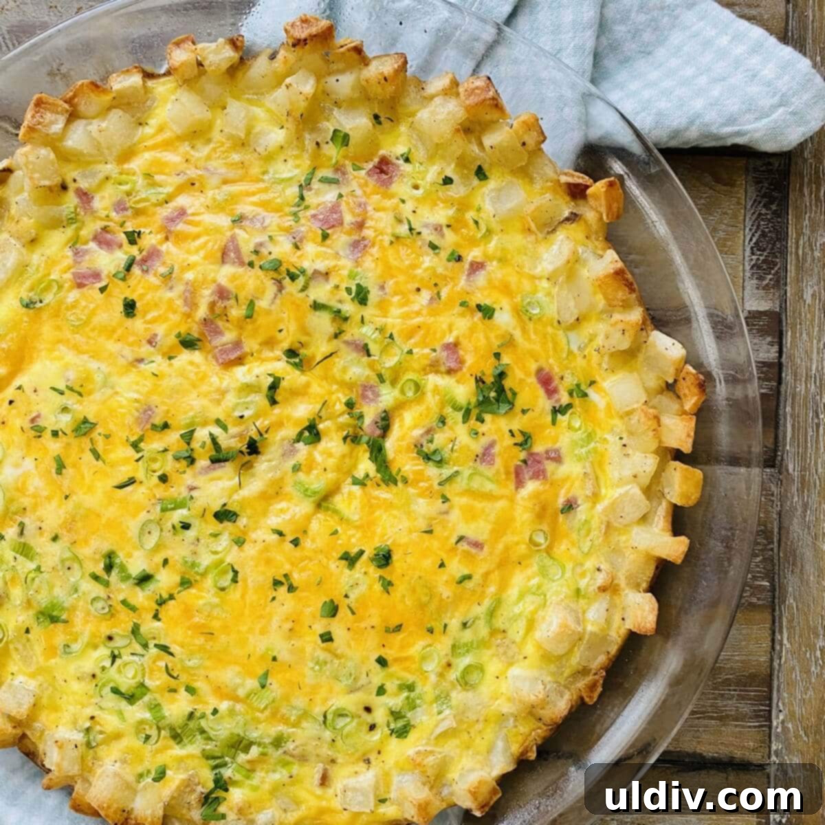 A hash brown crust quiche cooling on a rack, awaiting its first slice.