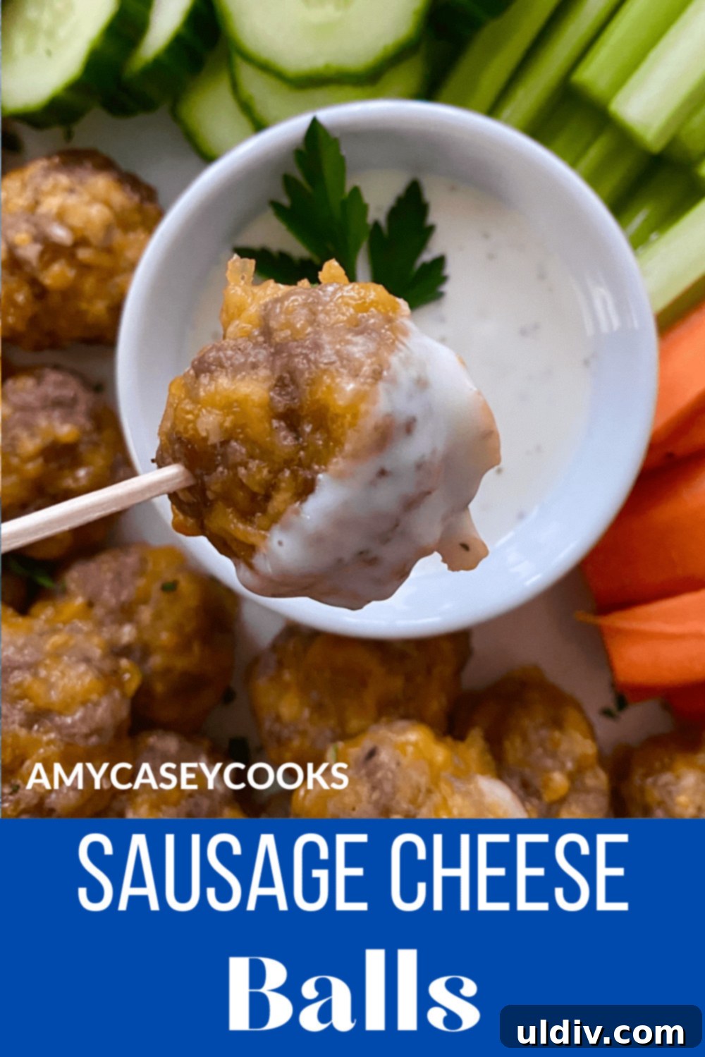 Grandma's Cheesy Bisquick Sausage Bites 11 Sausage cheese ball on a toothpick and dipped in ranch dressing