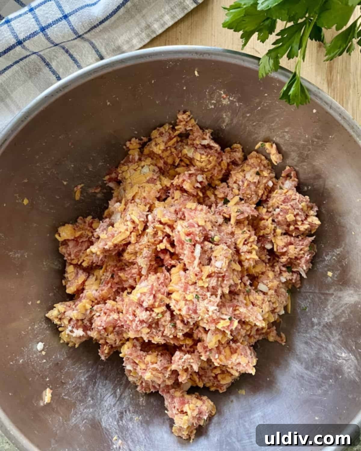 Grandma's Cheesy Bisquick Sausage Bites 6 Ingredients combined for sausage meatballs.