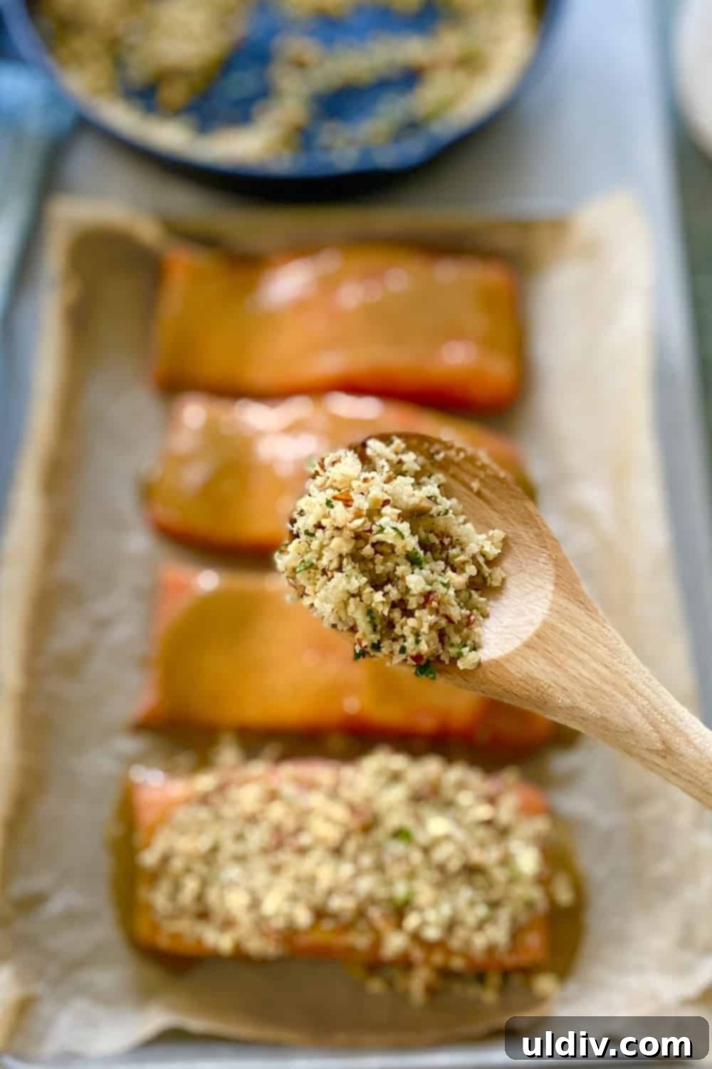 Golden Pecan Crusted Salmon with Honey Mustard 8 A spoon with pecan topping for salmon.