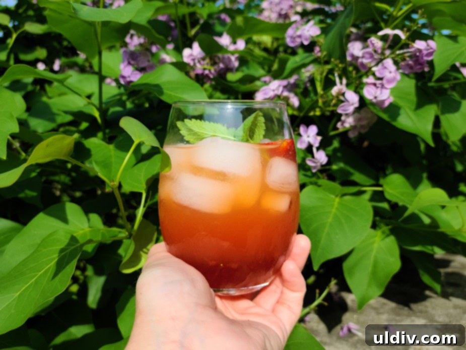 Summer Sips Lilac Mocktail Bliss 2 Freshly made lilac syrup in a clear bottle, ready for use.