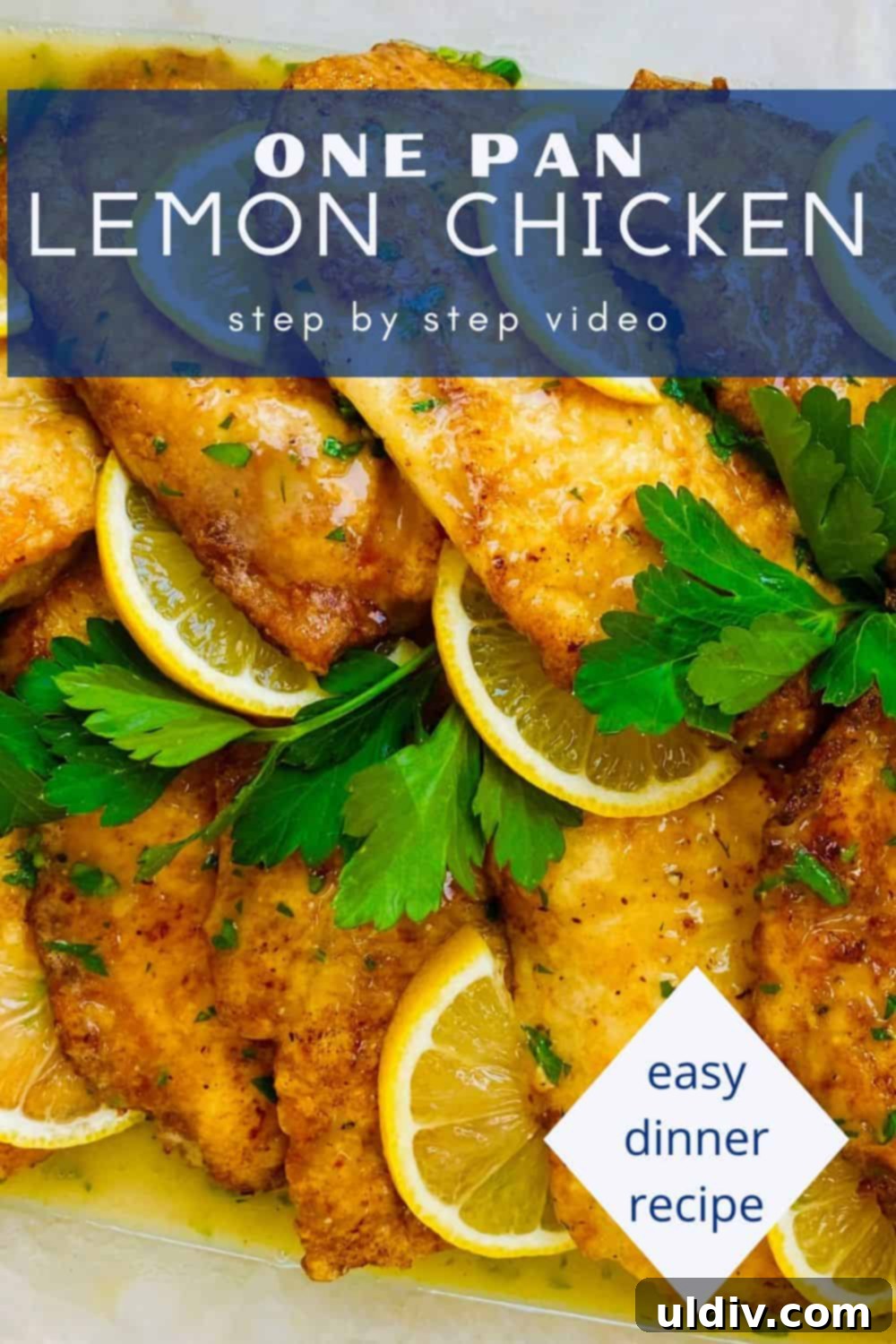 Chicken with a bright lemon sauce served in a clear glass baking dish, garnished with lemon slices.