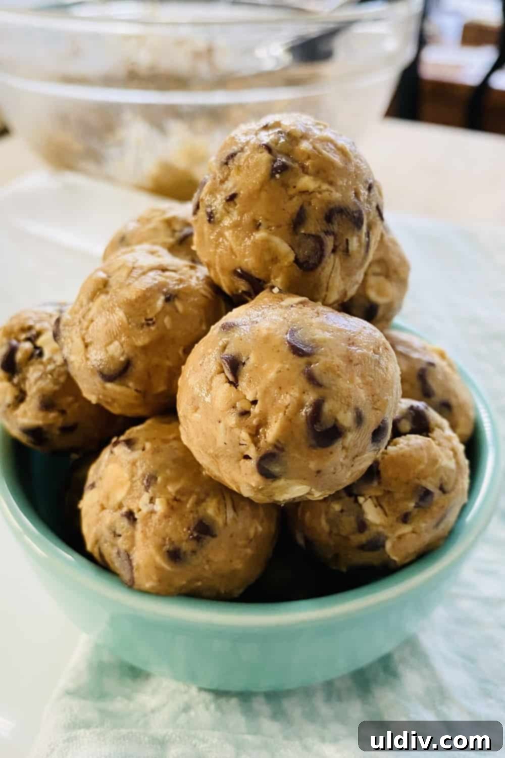 Decadent GlutenFree Peanut Butter Oat Bites 2 bowl with a tower of energy balls