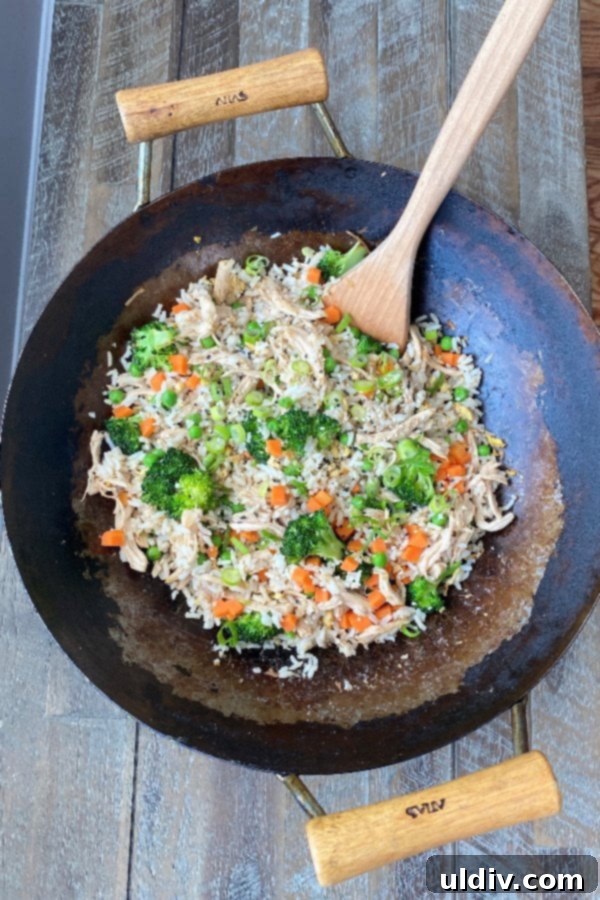 Restaurant-Quality Fried Rice and Chicken at Home 2 wok filled with a favorite Asian recipe