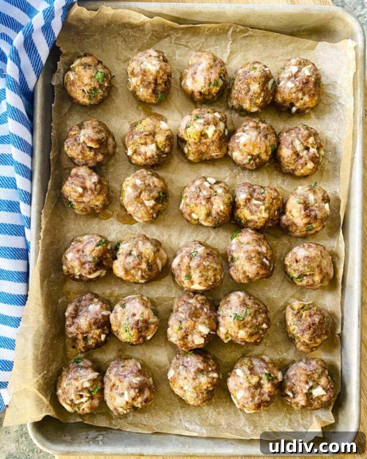 Quick and Easy Meatball Stroganoff 7 A baking sheet filled with golden-brown, baked meatballs, perfectly cooked through.