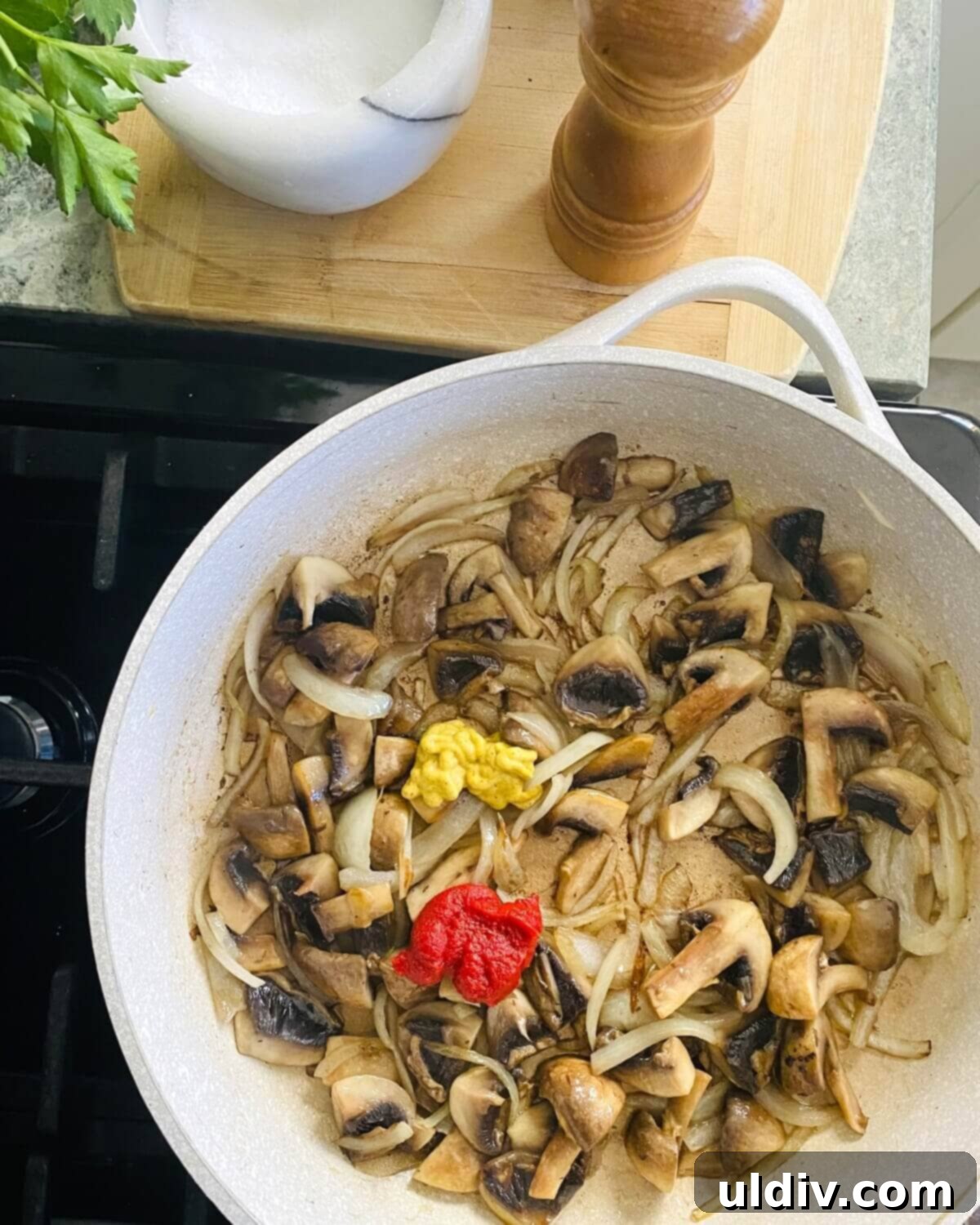 Quick and Easy Meatball Stroganoff 9 Tomato paste and Dijon mustard being incorporated into the sautéed mushroom and onion mixture.