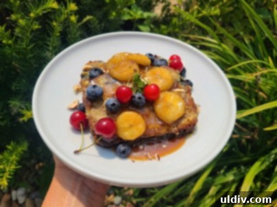 Summer's Sweetest Blueberry Creations 15 Indulgent banana bread French toast topped with caramelized bananas, blueberries, sour cherries, and chopped hazelnuts.