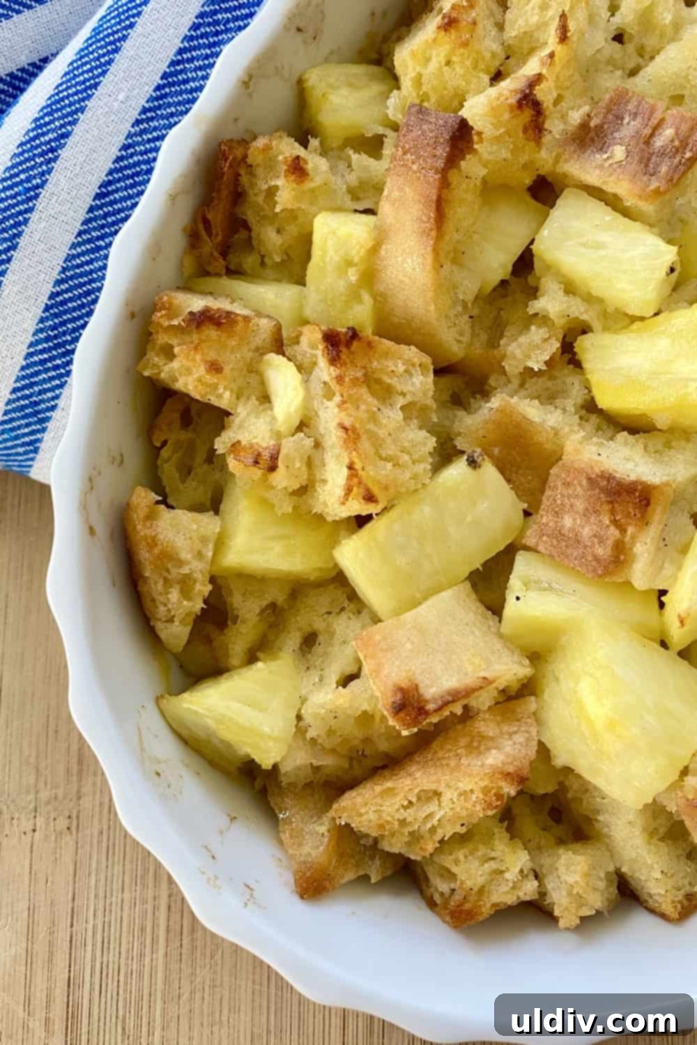 Tropical Pineapple Bread Pudding 9 A dish of baked bread pudding with pineapple.