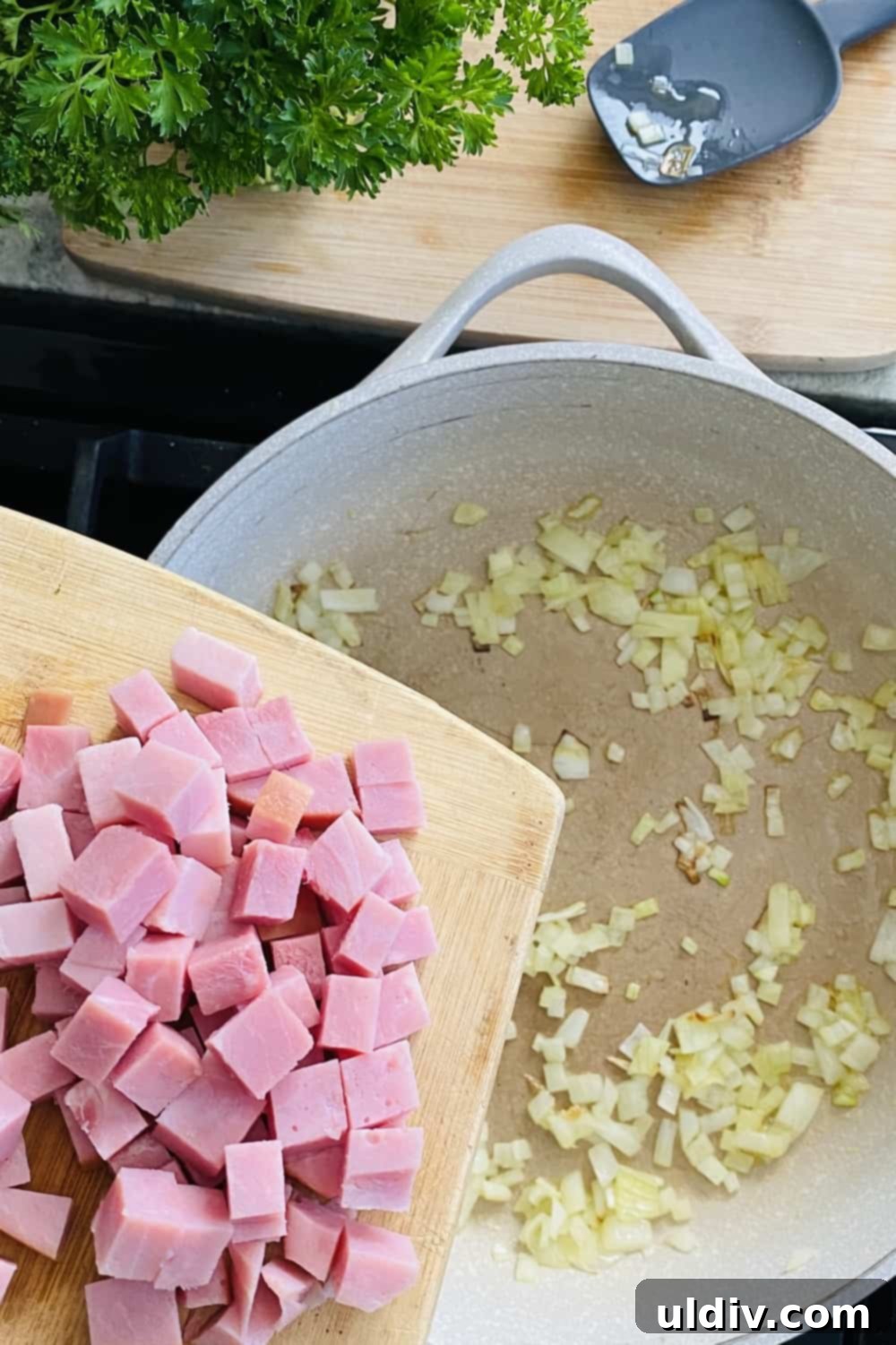 Savory Tortellini with Asparagus, Spinach, and Ham 5 Diced ham being added to a sauté pan with onions.