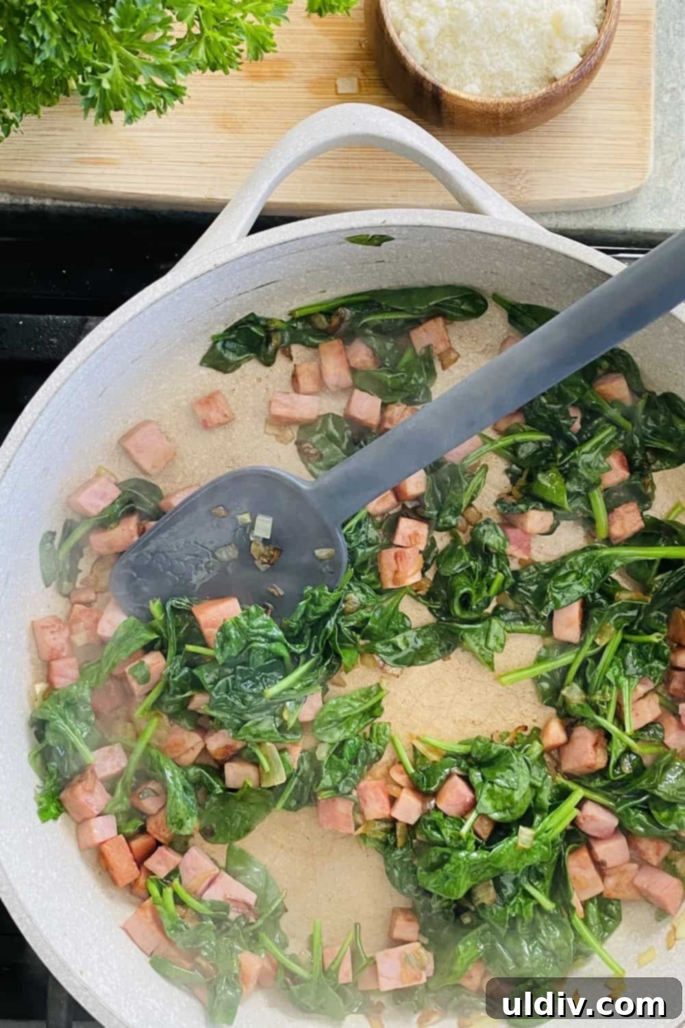 Savory Tortellini with Asparagus, Spinach, and Ham 6 Sautéing onion, ham, and spinach in a large pan.