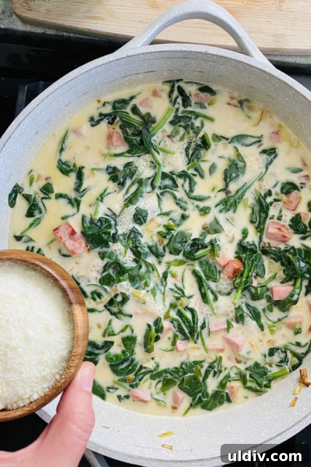 Asparagus, Spinach and Ham Tortellini 7 Sprinkling grated Parmesan cheese into a simmering creamy sauce