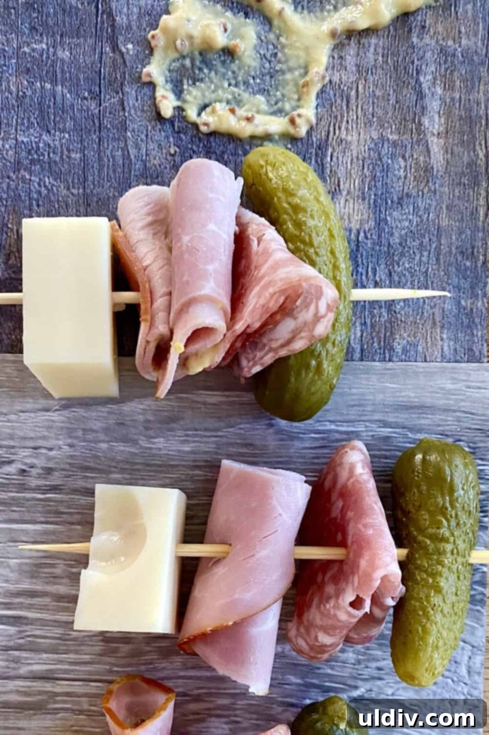 Mini Cuban Sandwich Skewers 6 A serving plate with Cuban skewers on it.