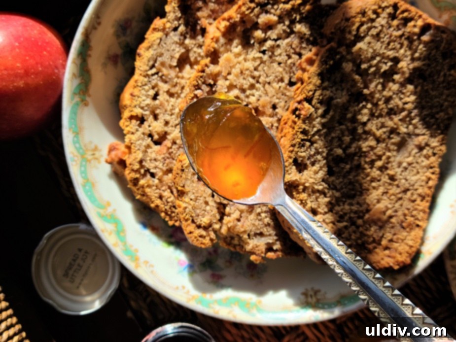 A jar of Tiptree orange marmalade, showcasing its rich color and texture.