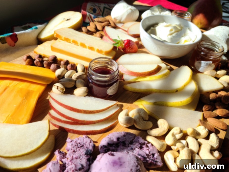 Festive Sweet Treats My Personal Picks For This Season And Always 7 A beautifully arranged charcuterie board featuring cheeses, fruits, nuts, and Tiptree preserves.