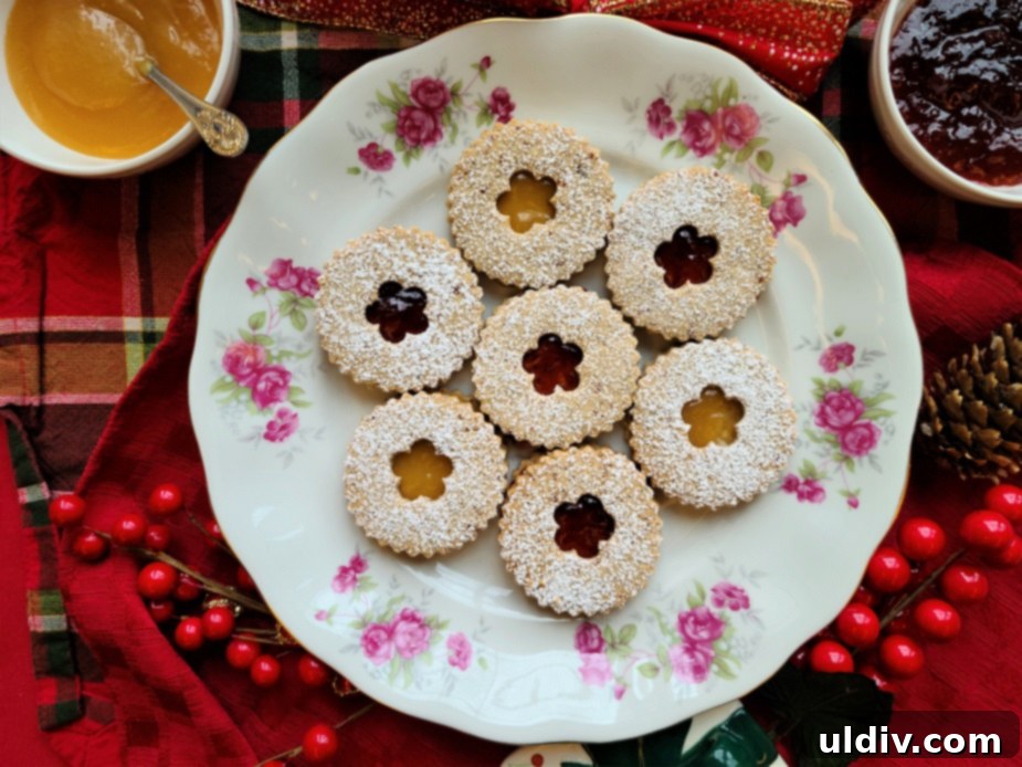Festive Sweet Treats My Personal Picks For This Season And Always 9 Pecan Linzer cookies, some filled with jam, others with a cutout top.