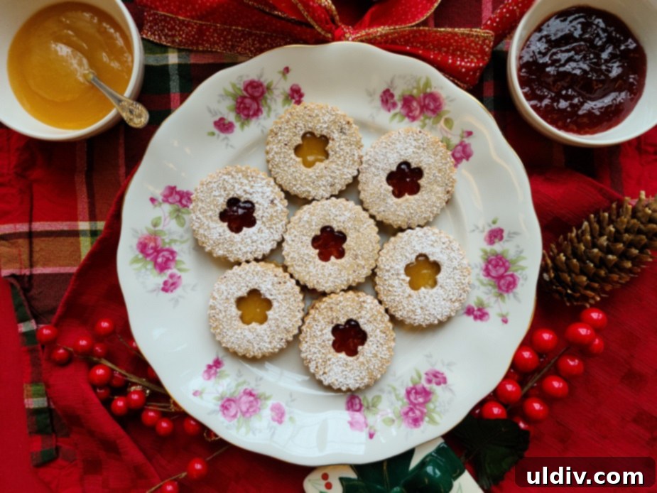 Festive Sweet Treats My Personal Picks For This Season And Always 10 Close-up of finished pecan Linzer cookies, showing the glistening jam filling.