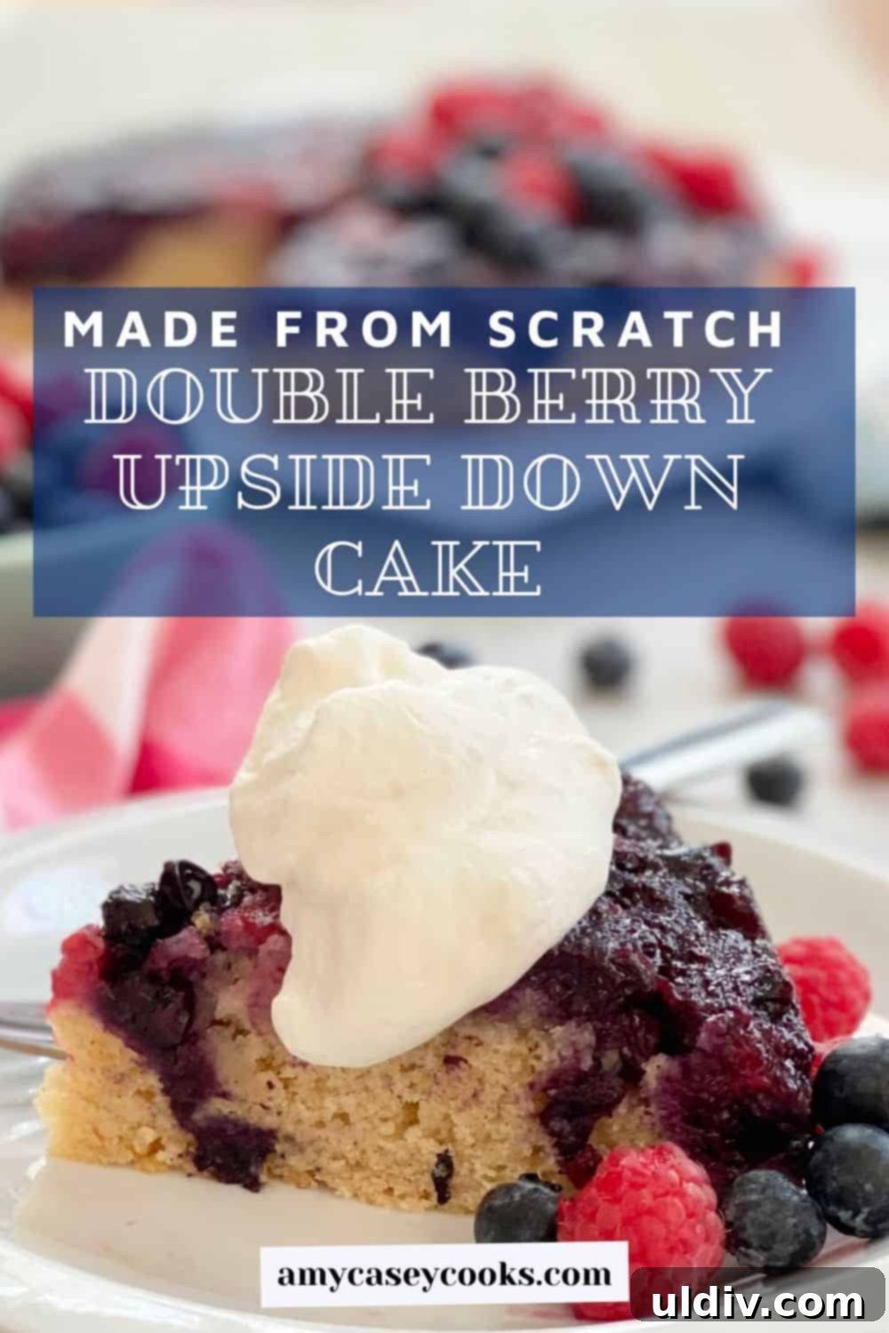Berry Burst Upside Down Cake 11 A slice of berry upside down cake adorned with whipped cream, ready to be enjoyed.
