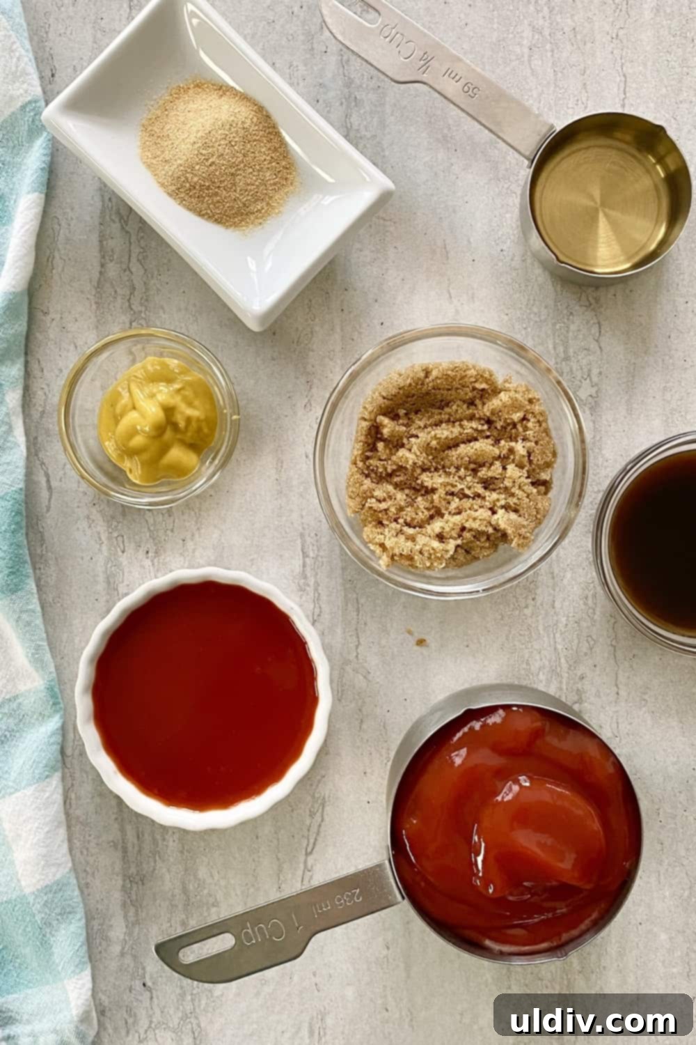 Easy Homemade BBQ Sauce 3 Key ingredients for homemade BBQ sauce: ketchup, brown sugar, Worcestershire sauce, mustard, garlic powder, and apple cider vinegar, neatly arranged.