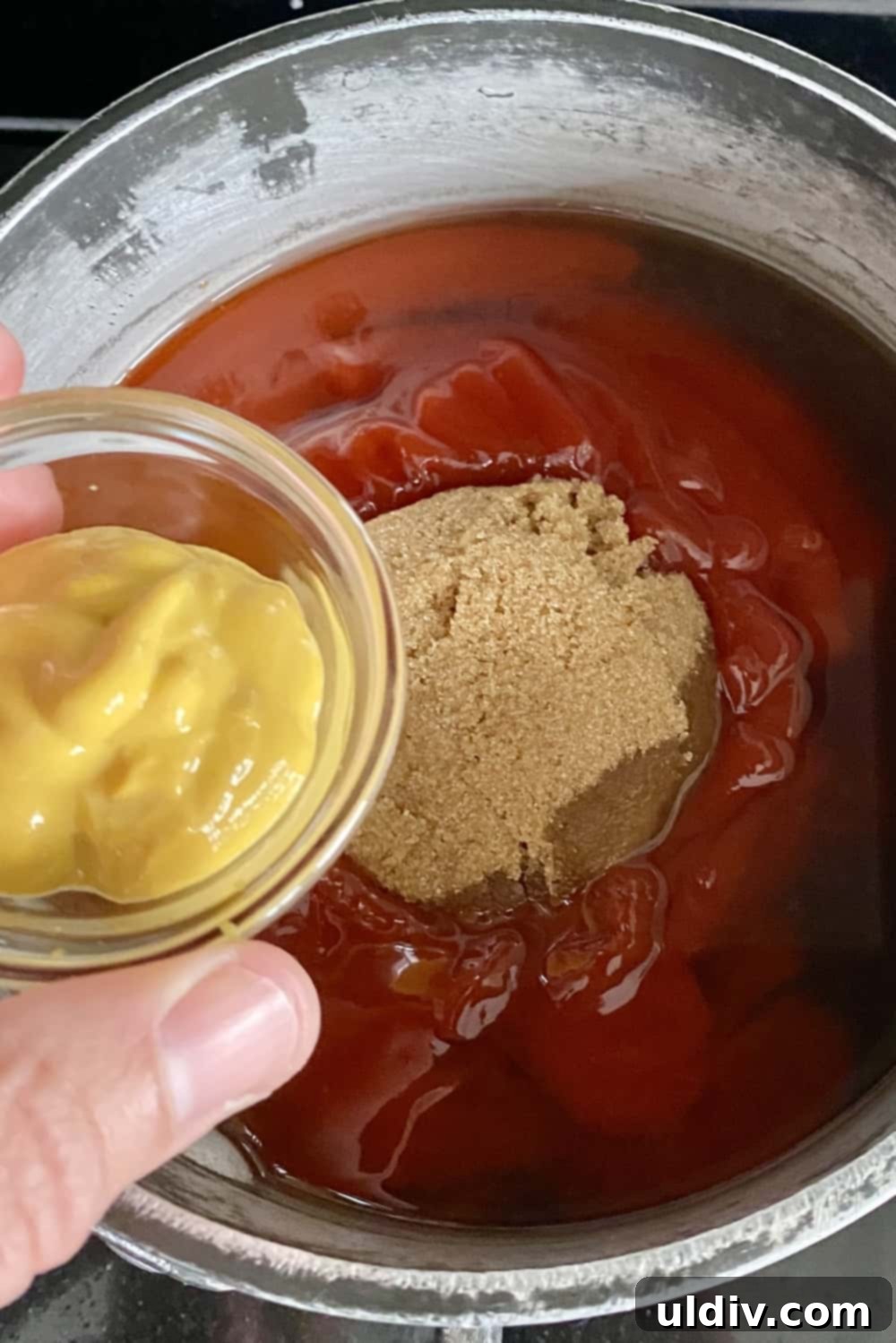 Simply Delicious Homemade BBQ Sauce 5 Close-up of essential BBQ sauce components: rich ketchup and golden brown sugar, highlighting their textures before mixing.